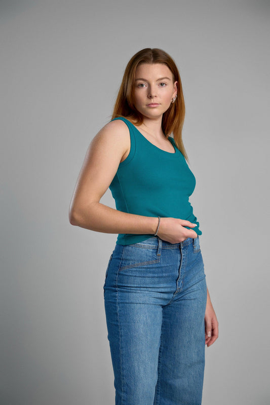 A stylish, green tank top made from recycled cotton, emphasizing eco-friendly materials and comfortable fit.