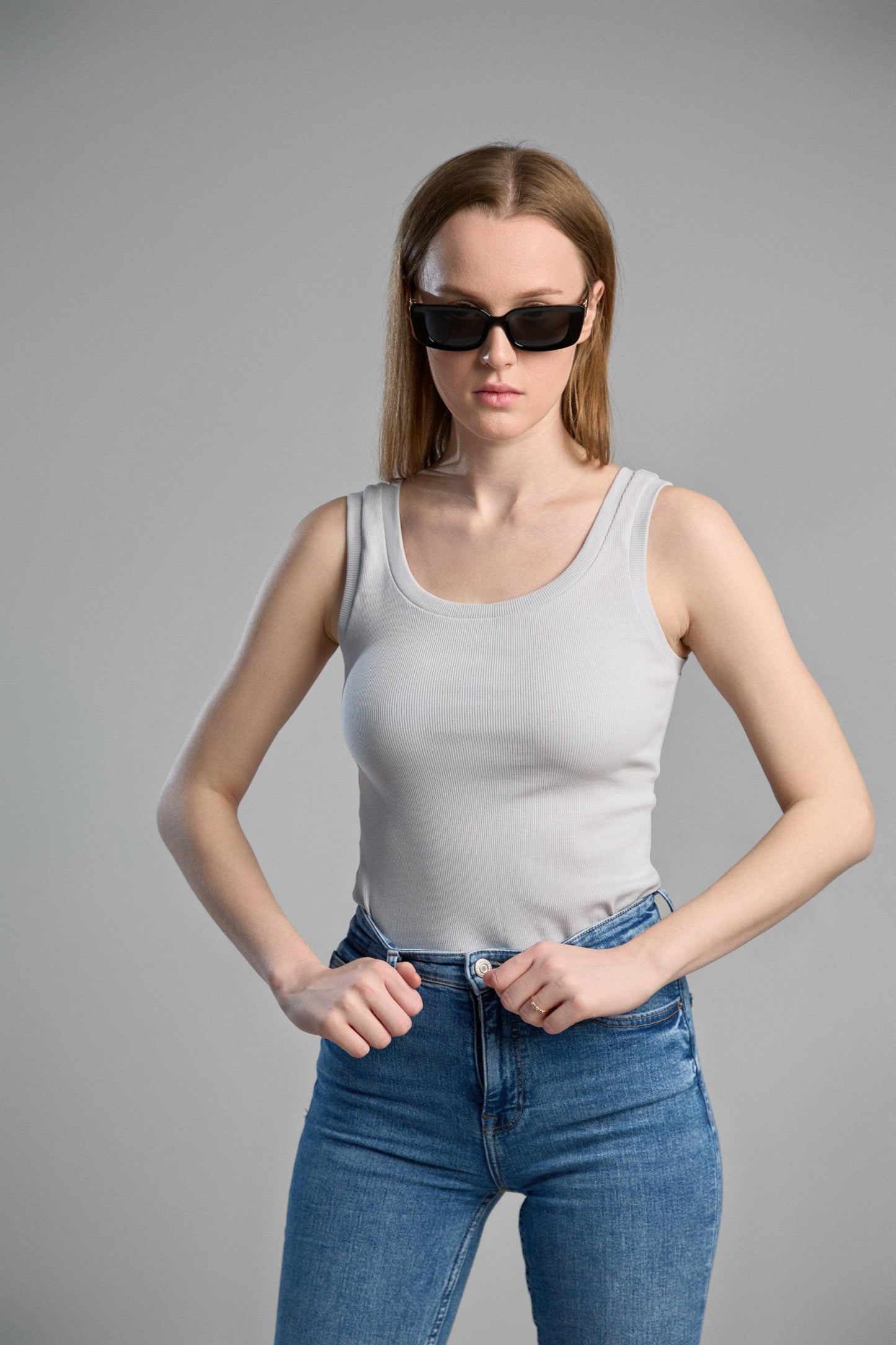 a stylish, grey tank top made from makö recycled cotton, emphasizing eco-friendly materials and comfortable fit.
