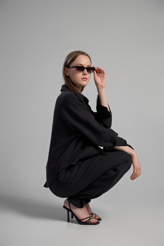 Women's black sustainable hemp set with straight leg pants and oversized shirt, perfect for all seasons and events.