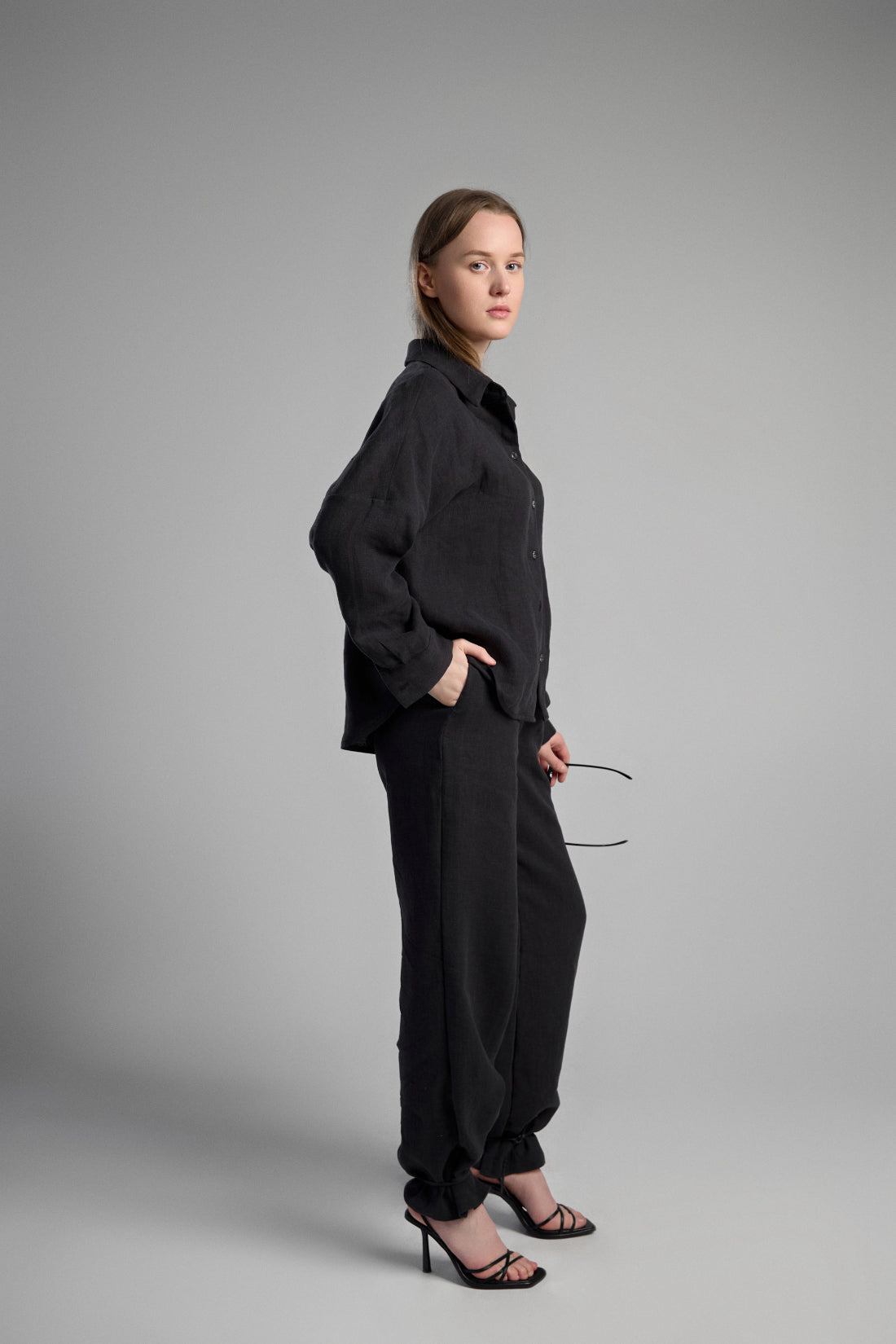Women's black sustainable hemp set with straight leg pants and oversized shirt, perfect for all seasons and events.
