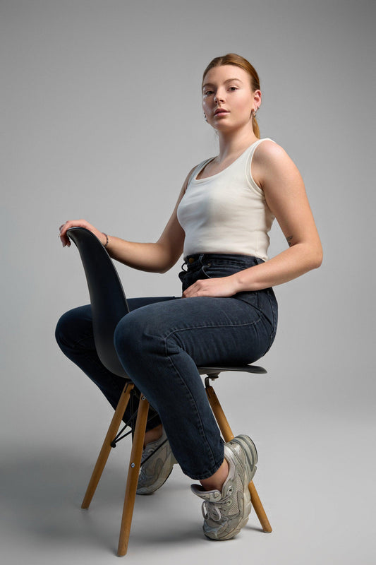 A stylish, ivory tank top made from recycled cotton, emphasizing eco-friendly materials and comfortable fit.