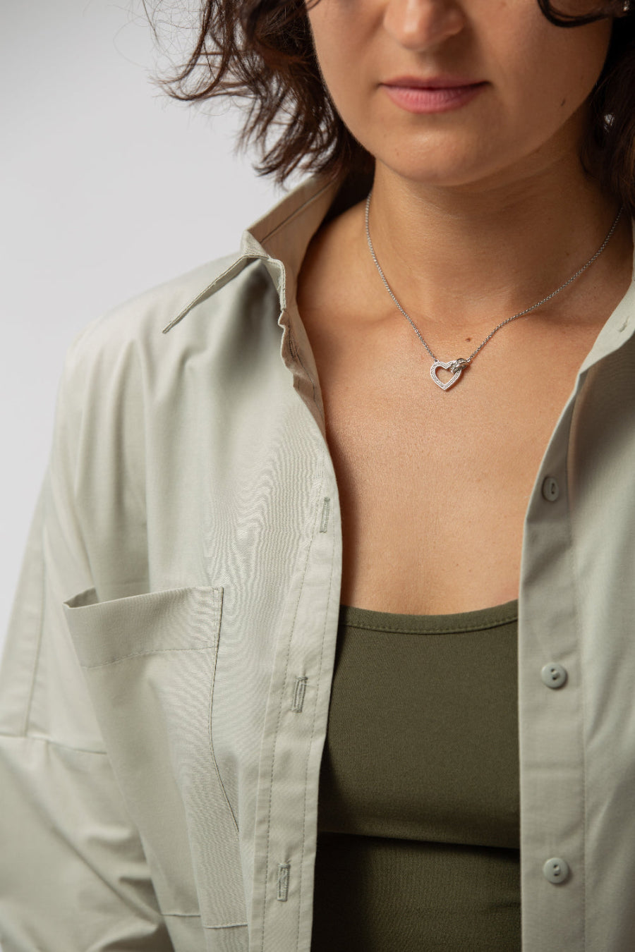 makö women's oversized sage green basic shirt, perfect for a classic and versatile wardrobe essential.