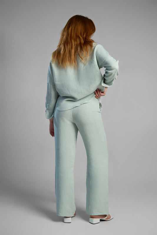 Women's light green sustainable hemp set with straight leg pants and oversized shirt, perfect for all seasons and events.