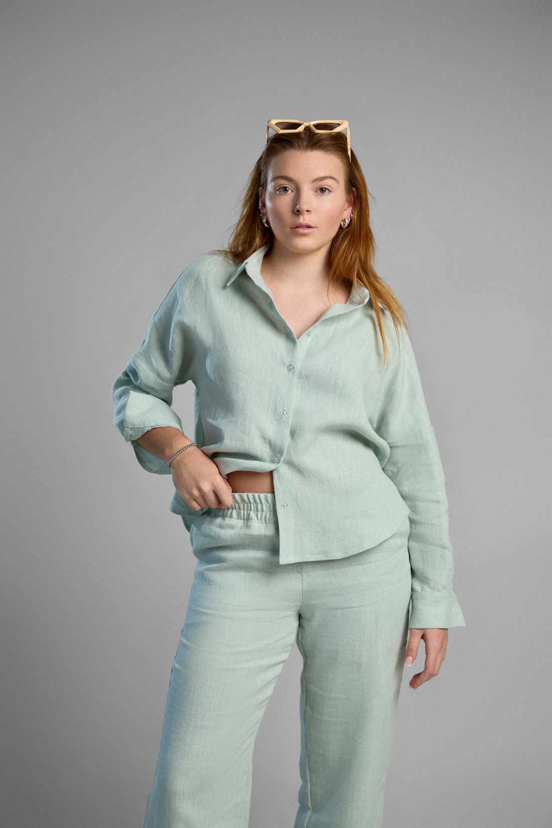 Women's light green sustainable hemp set with straight leg pants and oversized shirt, perfect for all seasons and events.