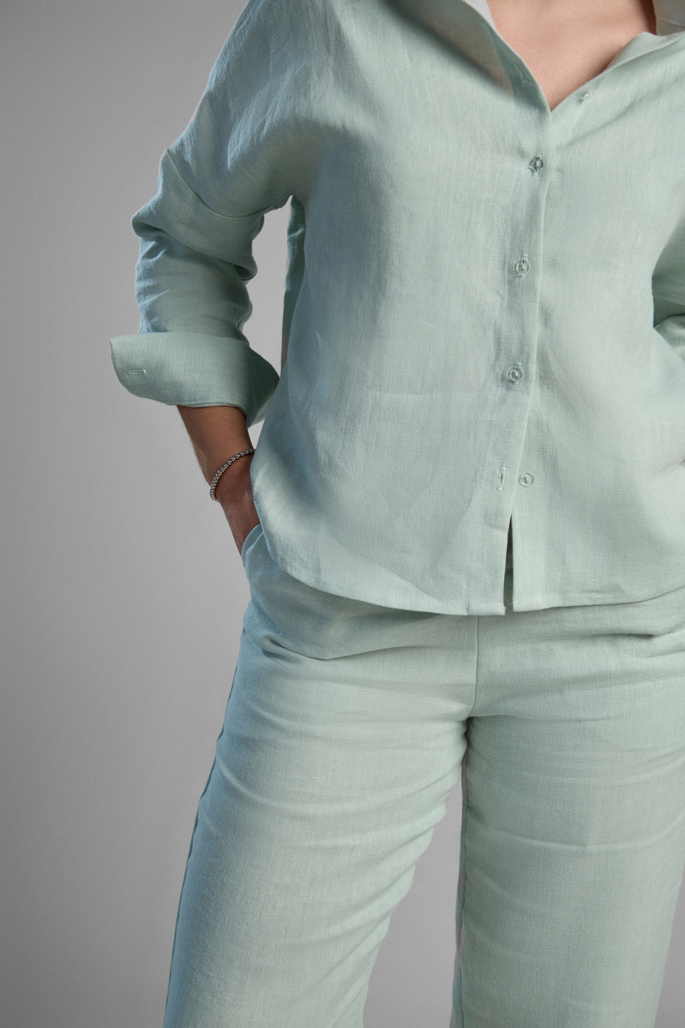 Women's light green sustainable hemp set with straight leg pants and oversized shirt, perfect for all seasons and events.