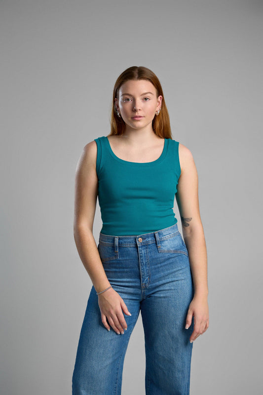 A stylish, green tank top made from recycled cotton, emphasizing eco-friendly materials and comfortable fit.