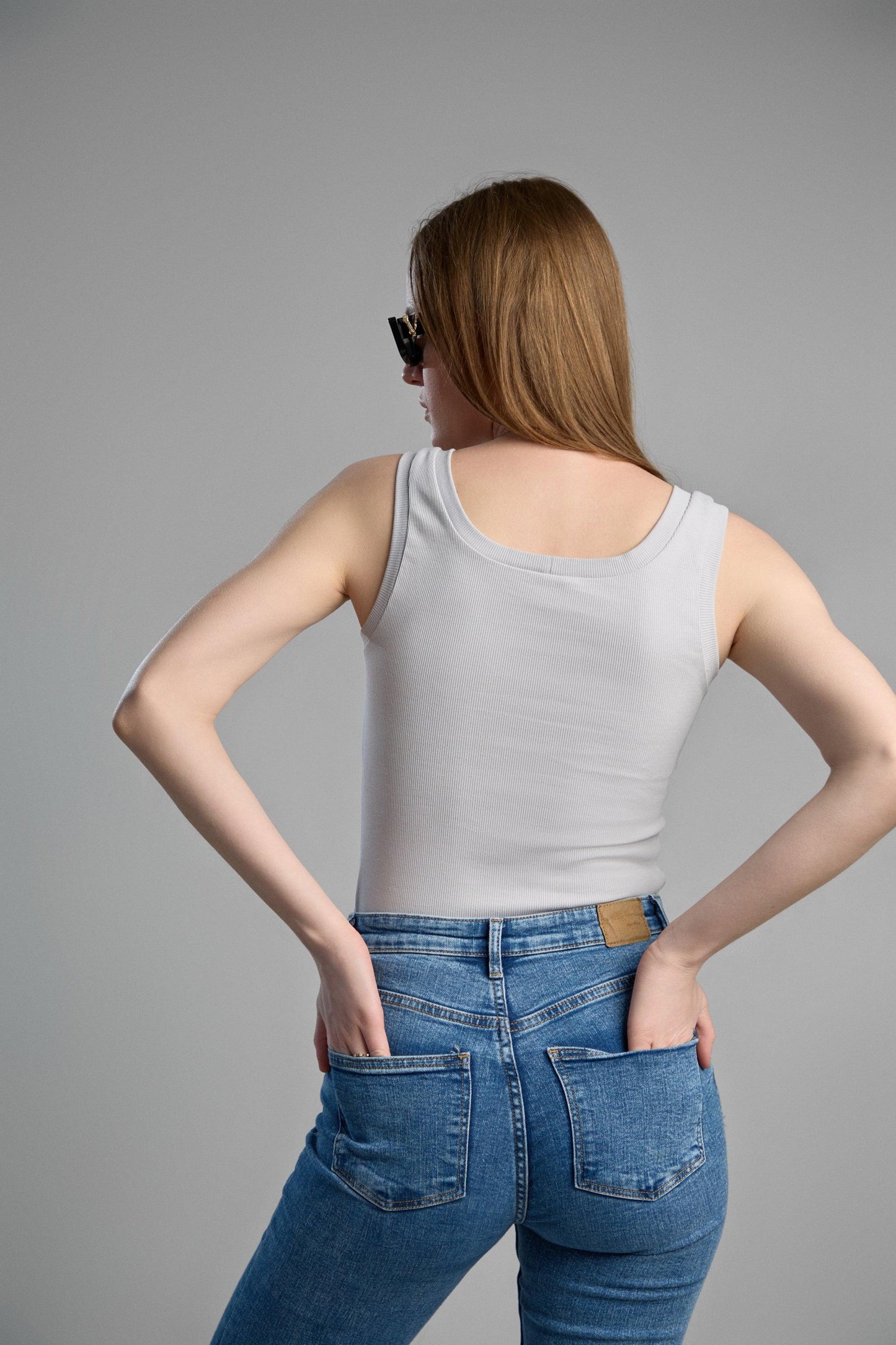 a stylish, grey tank top made from makö recycled cotton, emphasizing eco-friendly materials and comfortable fit.