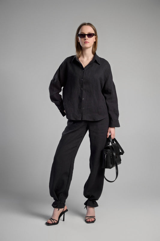 Women's black sustainable hemp set with straight leg pants and oversized shirt, perfect for all seasons and events.