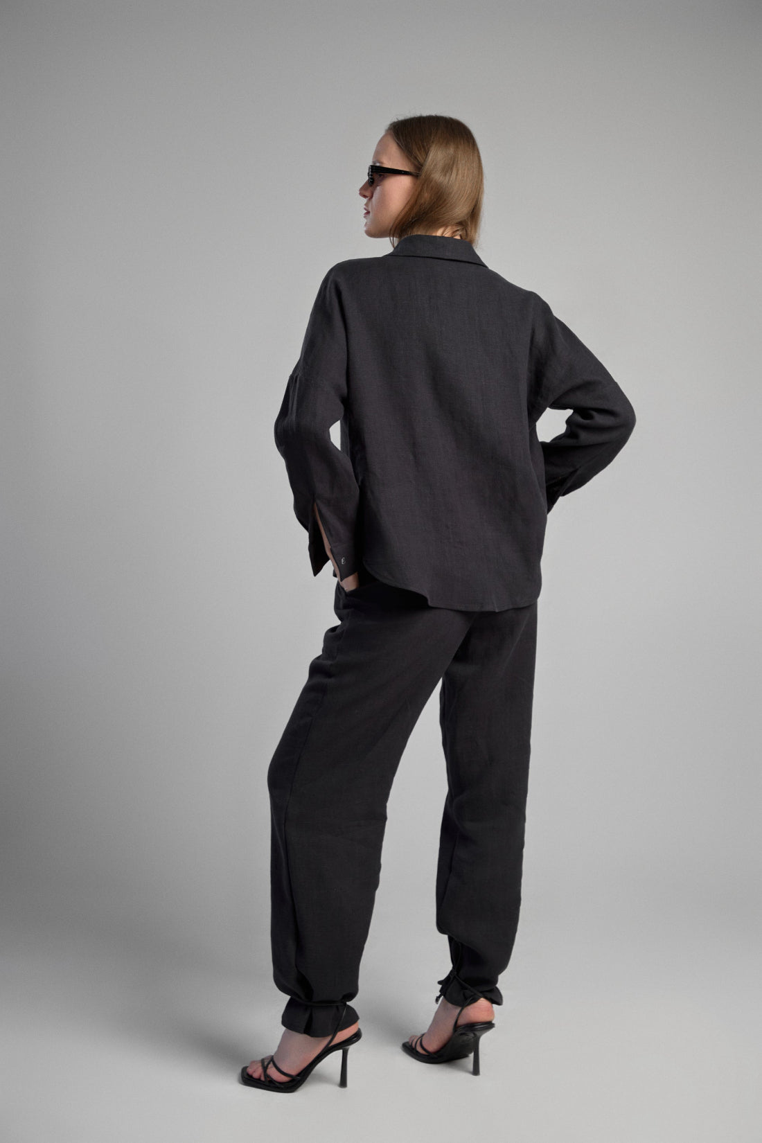 Women's black sustainable hemp set with straight leg pants and oversized shirt, perfect for all seasons and events.
