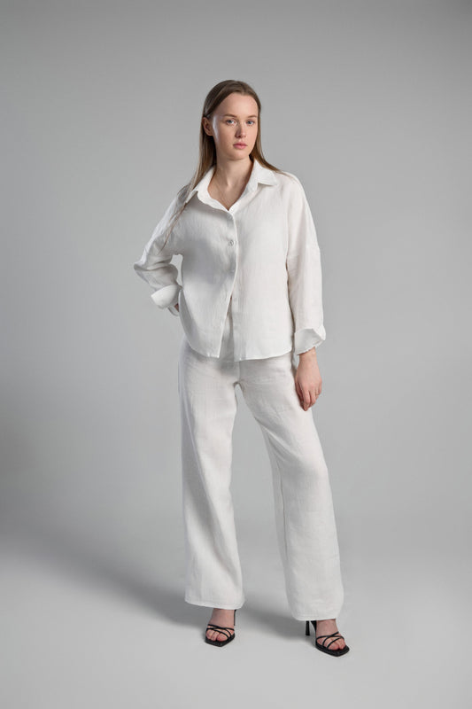 Women's white sustainable hemp set with straight leg pants and oversized shirt. Perfect for all seasons and events.